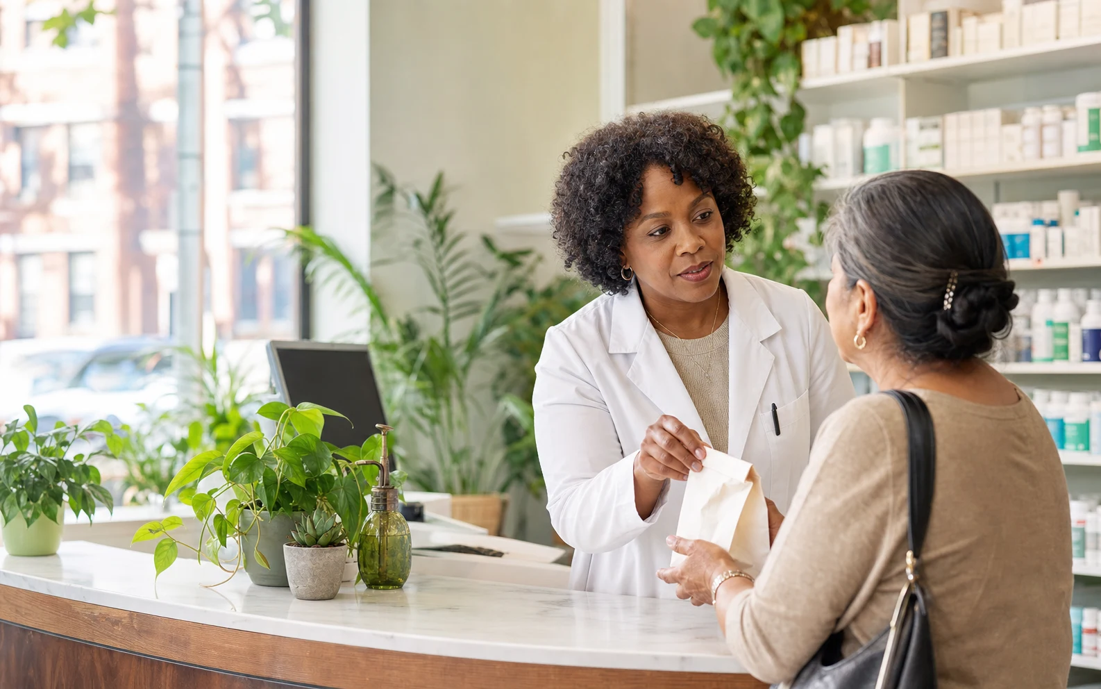 Carewell pharmacist helping a customer